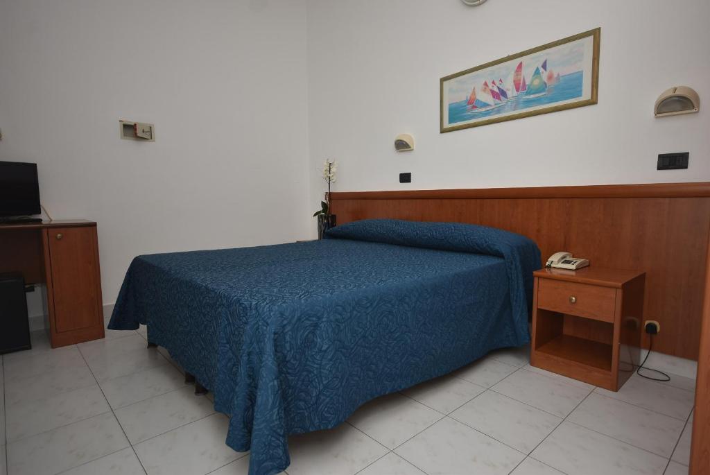 Postel nebo postele na pokoji v ubytování Hotel Eden