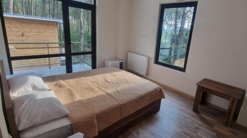 Postel nebo postele na pokoji v ubytování Kartuli Suli