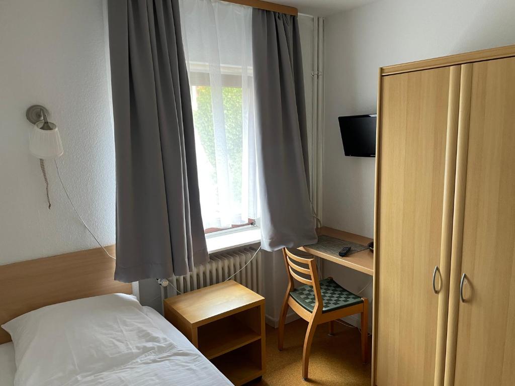 Postel nebo postele na pokoji v ubytování ApartHotel Stadtpark
