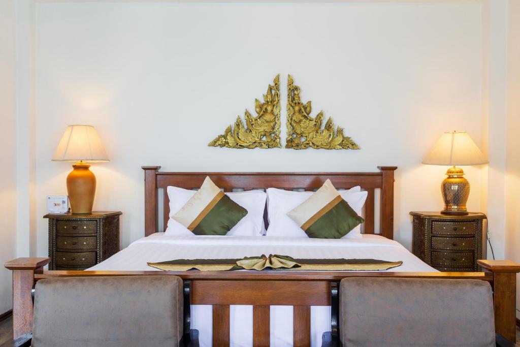 Postel nebo postele na pokoji v ubytování Rajapruek Samui Resort - SHA Plus