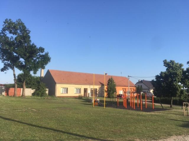 a park with a playground in front of a house at Chalupa Žofka in Brod nad Dyjí