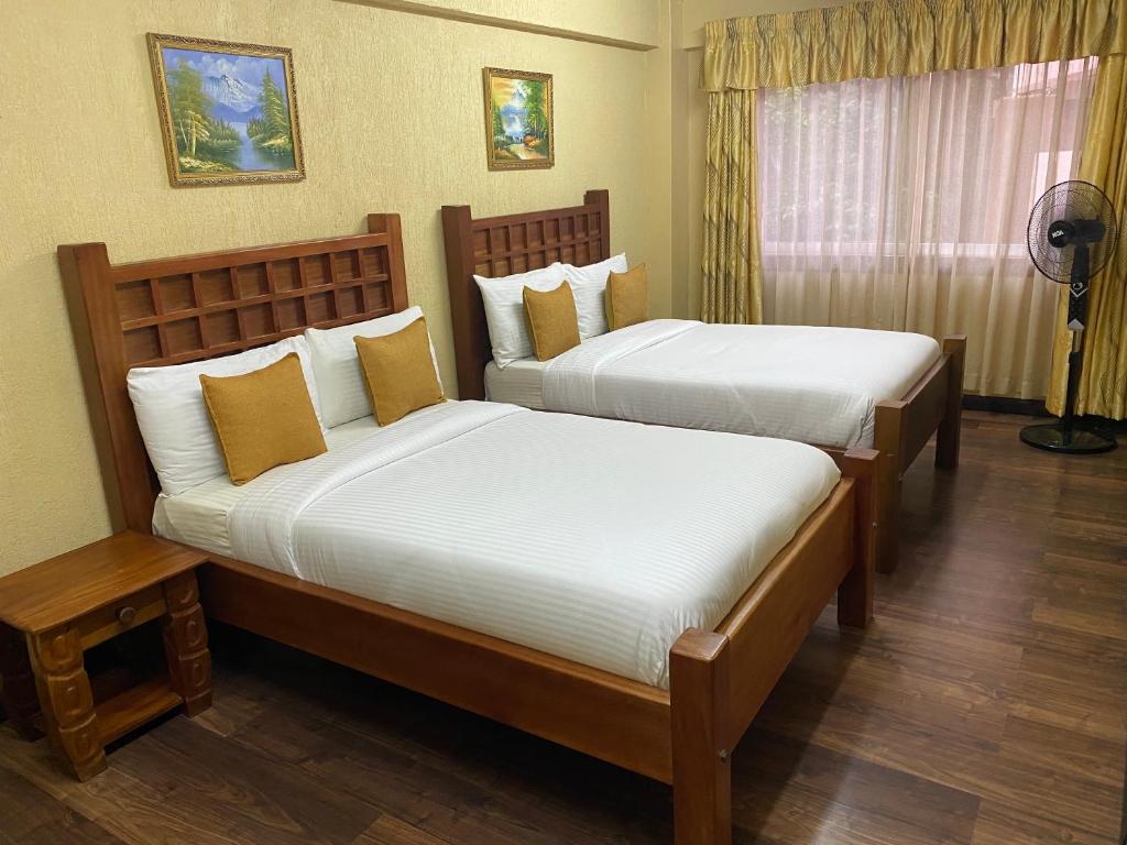 Postel nebo postele na pokoji v ubytování Progressive Park Hotel