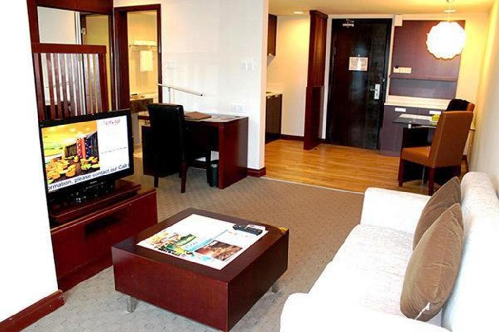 TV a/nebo společenská místnost v ubytování Ming Garden Hotel & Residences