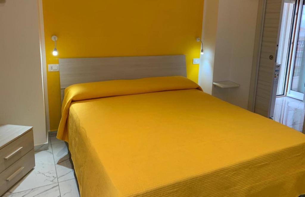 En eller flere senge i et værelse på Miniappartamenti da Lello