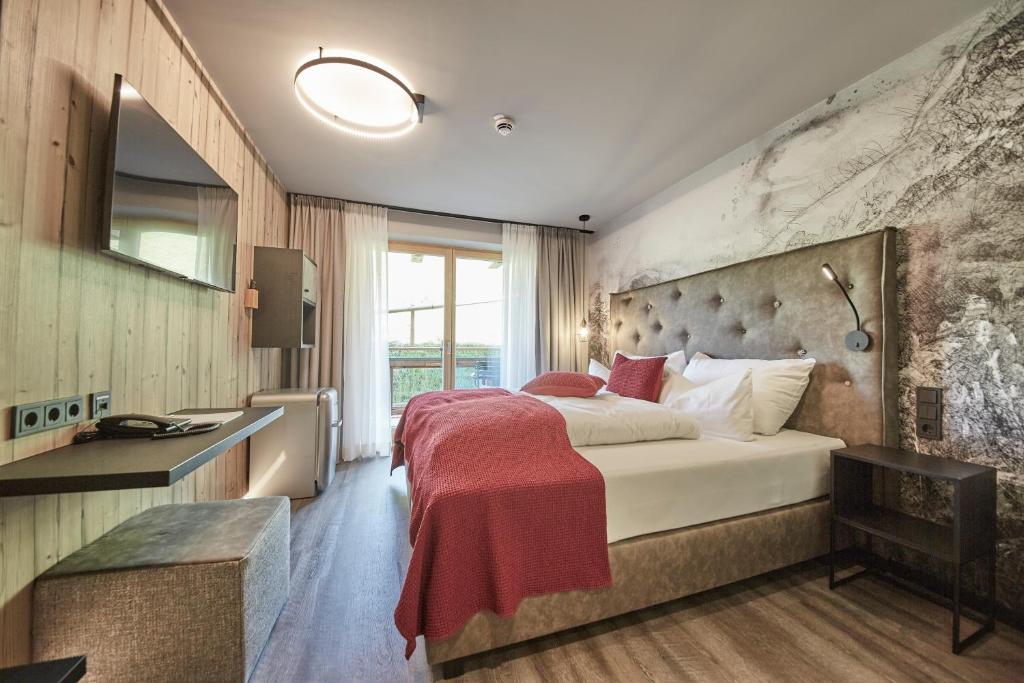 Postel nebo postele na pokoji v ubytování Hotel Astrid - inklusive kostenfreier JokerCard