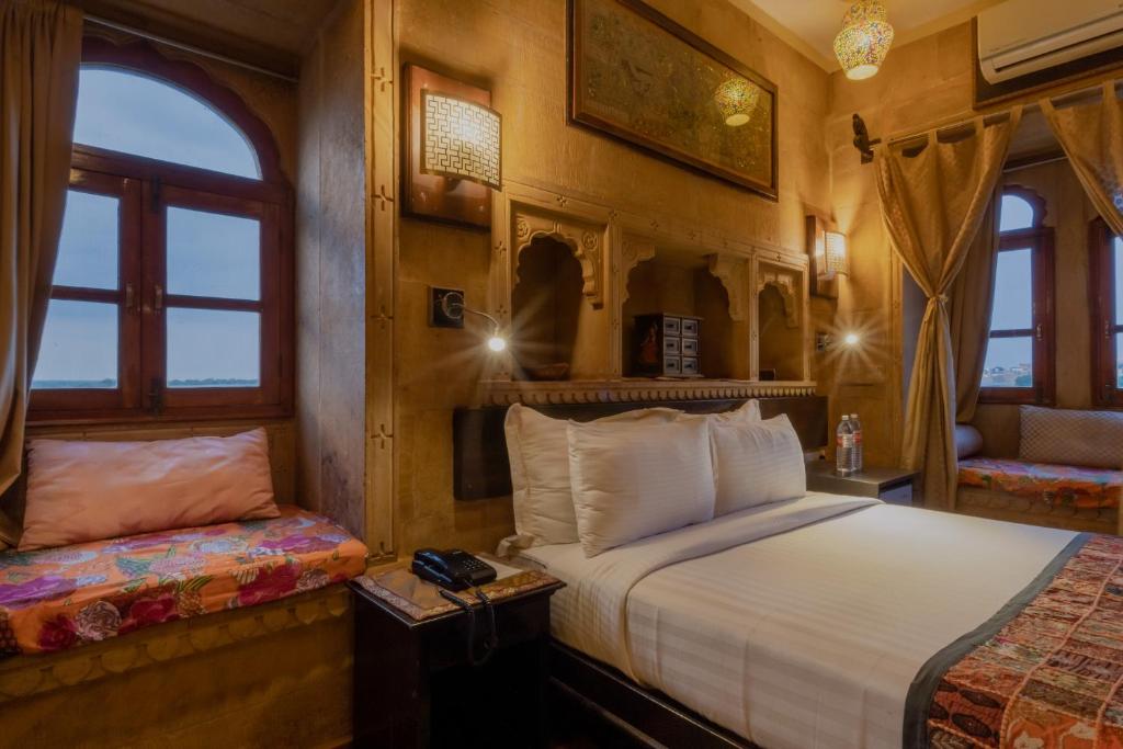 Postel nebo postele na pokoji v ubytování Hotel Fifu
