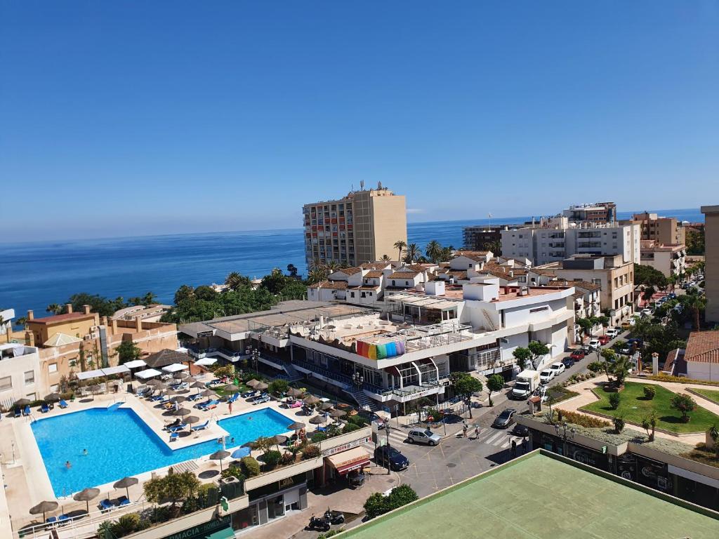 an aerial view of a city with a pool at Nogalera Sea&Sun Apartment in Torremolinos