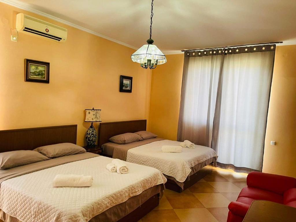 Postel nebo postele na pokoji v ubytování Villa Gardenia Ureki