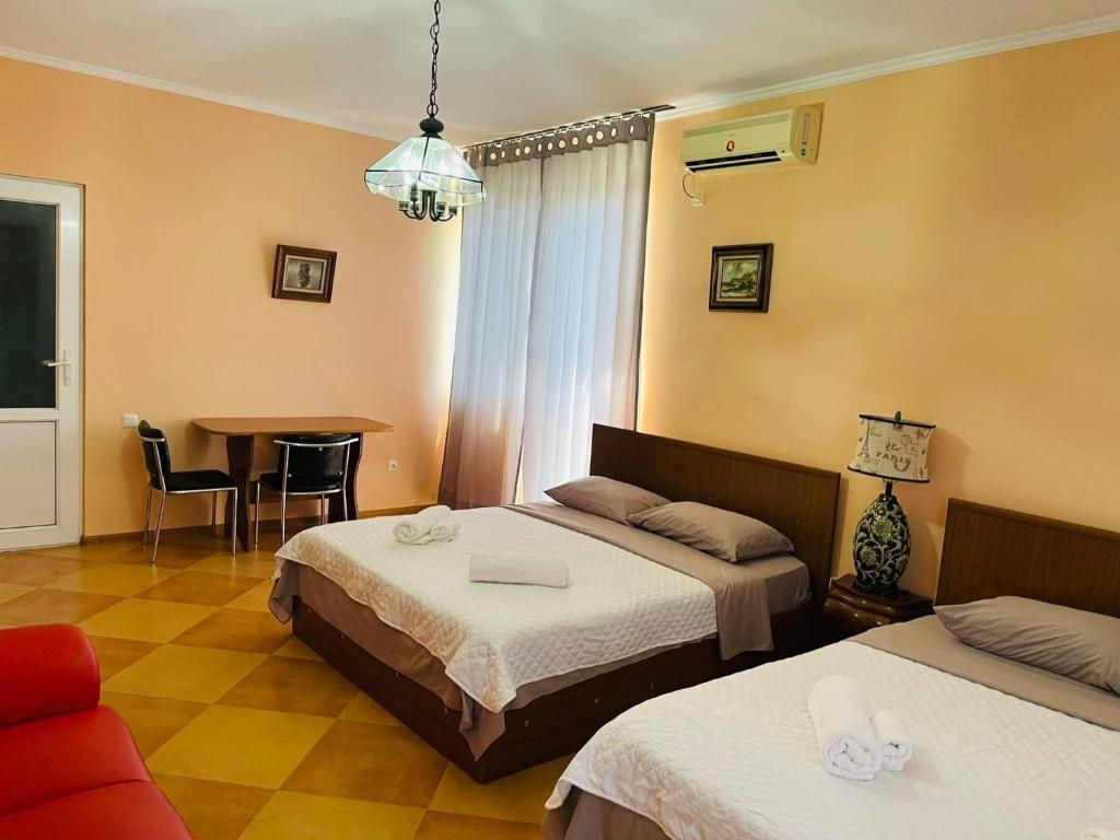 Postel nebo postele na pokoji v ubytování Villa Gardenia Ureki
