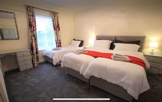 Katil atau katil-katil dalam bilik di Ballyconnelly Cottages, Galgorm area
