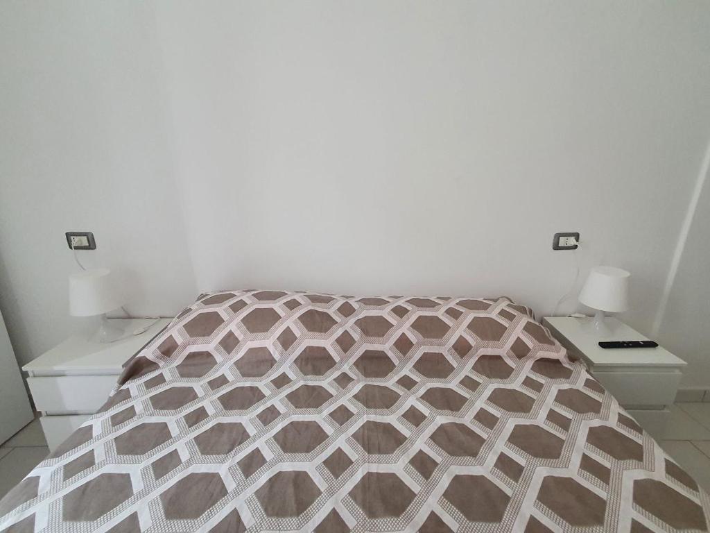 Łóżko lub łóżka w pokoju w obiekcie Affittacamere Casa Cynda