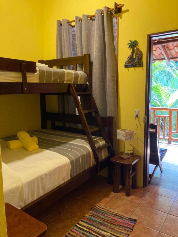 Postel nebo postele na pokoji v ubytování Tico Adventure Lodge