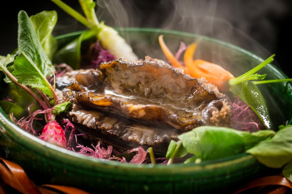 a bowl of food with meat and vegetables at Kanazawa Hyakurakusou in Kanazawa