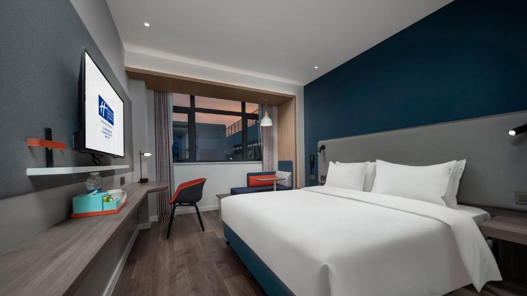 Postel nebo postele na pokoji v ubytování Holiday Inn Express Shanghai Qingpu New City by IHG