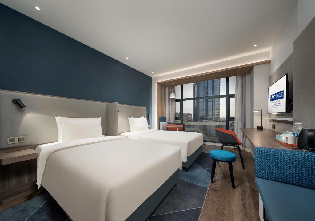 Postel nebo postele na pokoji v ubytování Holiday Inn Express Shanghai Qingpu New City by IHG