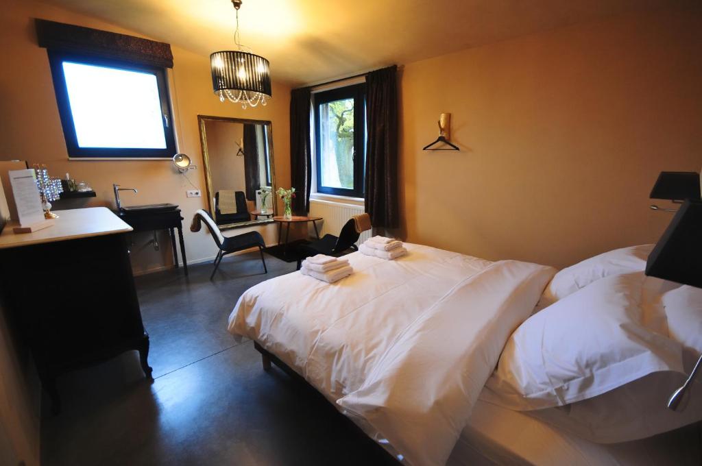 Postel nebo postele na pokoji v ubytování Maison d'Hôtes Cerf'titude