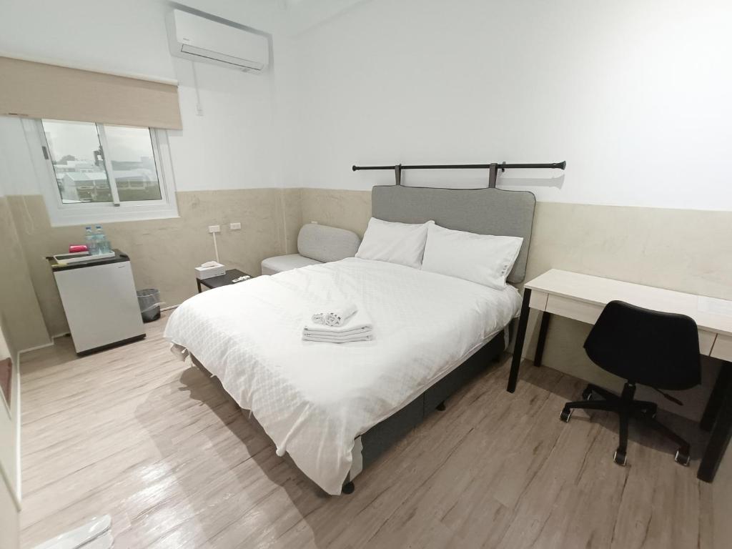 Postel nebo postele na pokoji v ubytování No 9 Hotel-九號文旅
