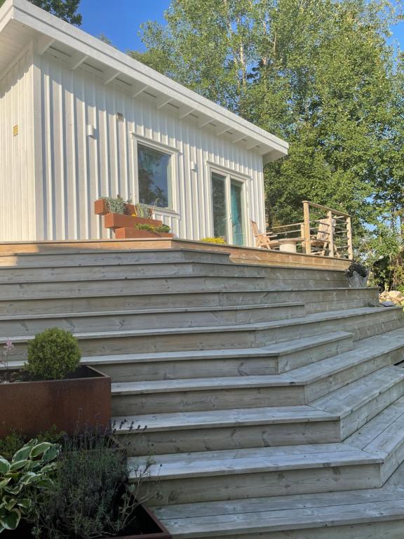 a set of stairs leading up to a house at Stuga in Myggenäs