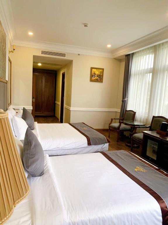 Voodi või voodid majutusasutuse AVS Hotel Phu Quoc toas