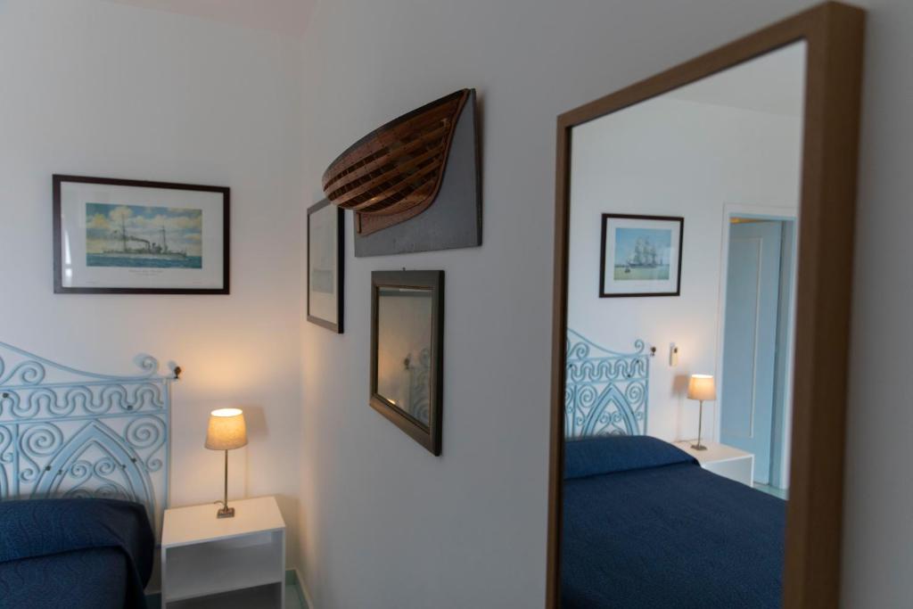 Postel nebo postele na pokoji v ubytování Hotel Agave e Ginestra