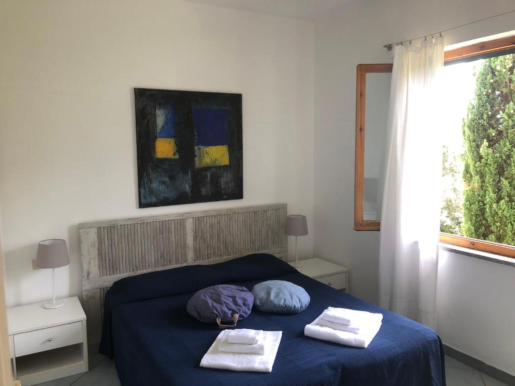 Кровать или кровати в номере Belvedere Residenza Mediterranea