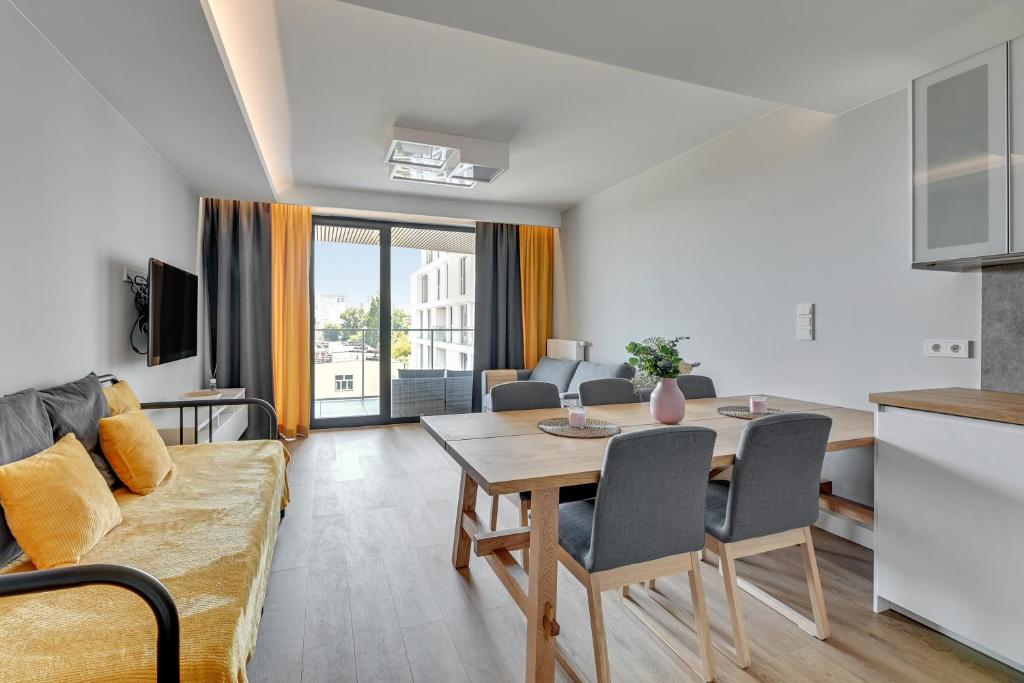 Televízia a/alebo spoločenská miestnosť v ubytovaní Tarasy Bałtyku Seaside, Sauna, Gym & Free Parking by Downtown Apartments