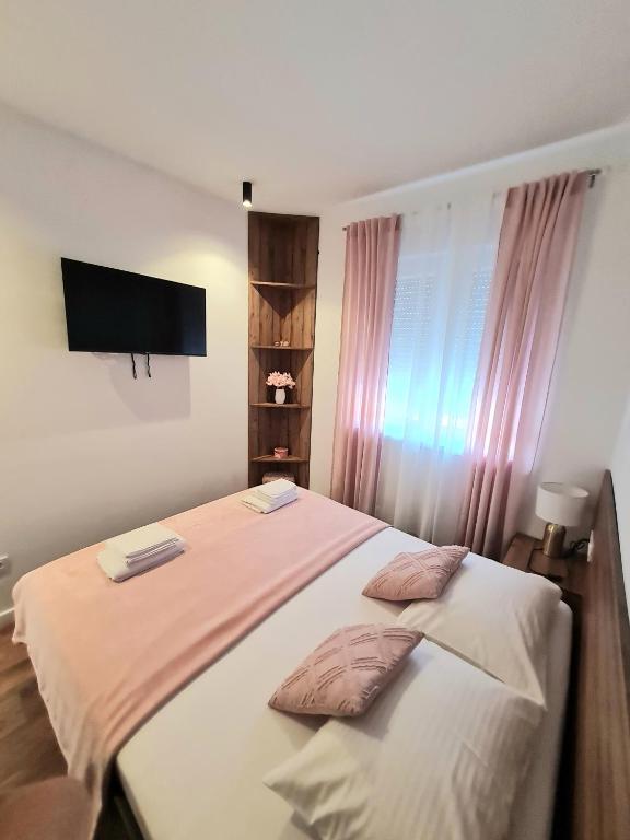 Posteľ alebo postele v izbe v ubytovaní Didova kuća