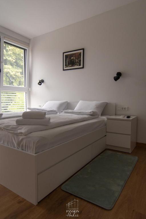 Postel nebo postele na pokoji v ubytování Pansion Hukić B&B