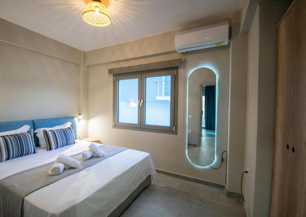 Postel nebo postele na pokoji v ubytování Heraclea Luxury Suites