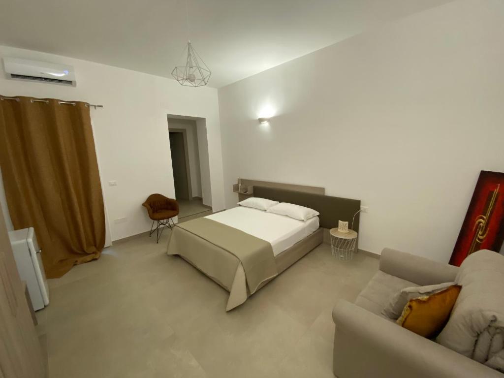 Postel nebo postele na pokoji v ubytování ViaMazzini24-Suite