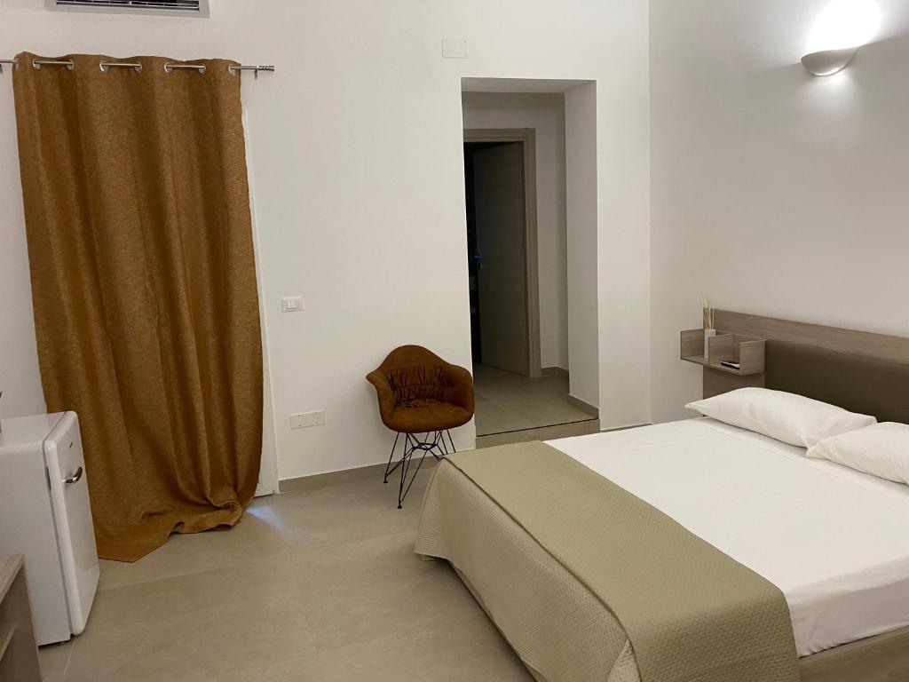 Postel nebo postele na pokoji v ubytování ViaMazzini24-Suite