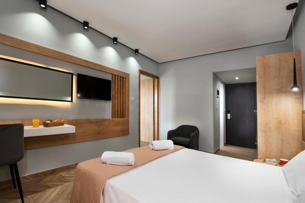 Postel nebo postele na pokoji v ubytování Galaxy Hotel