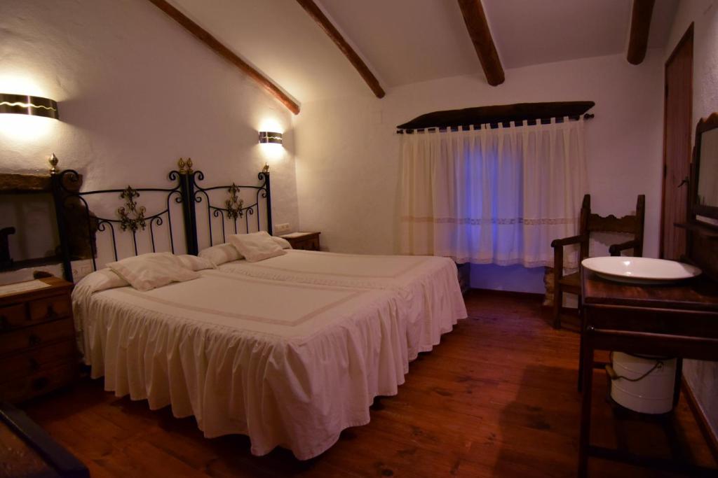 Posteľ alebo postele v izbe v ubytovaní Puerto Roque Turismo Rural