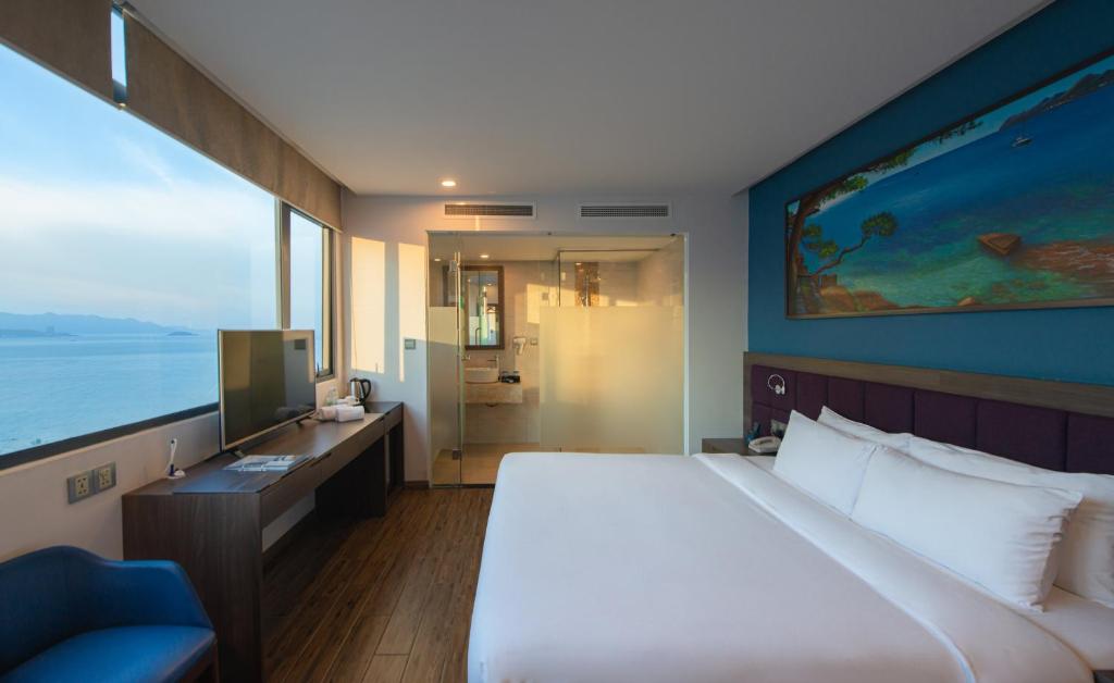 Giường trong phòng chung tại Aaron Hotel