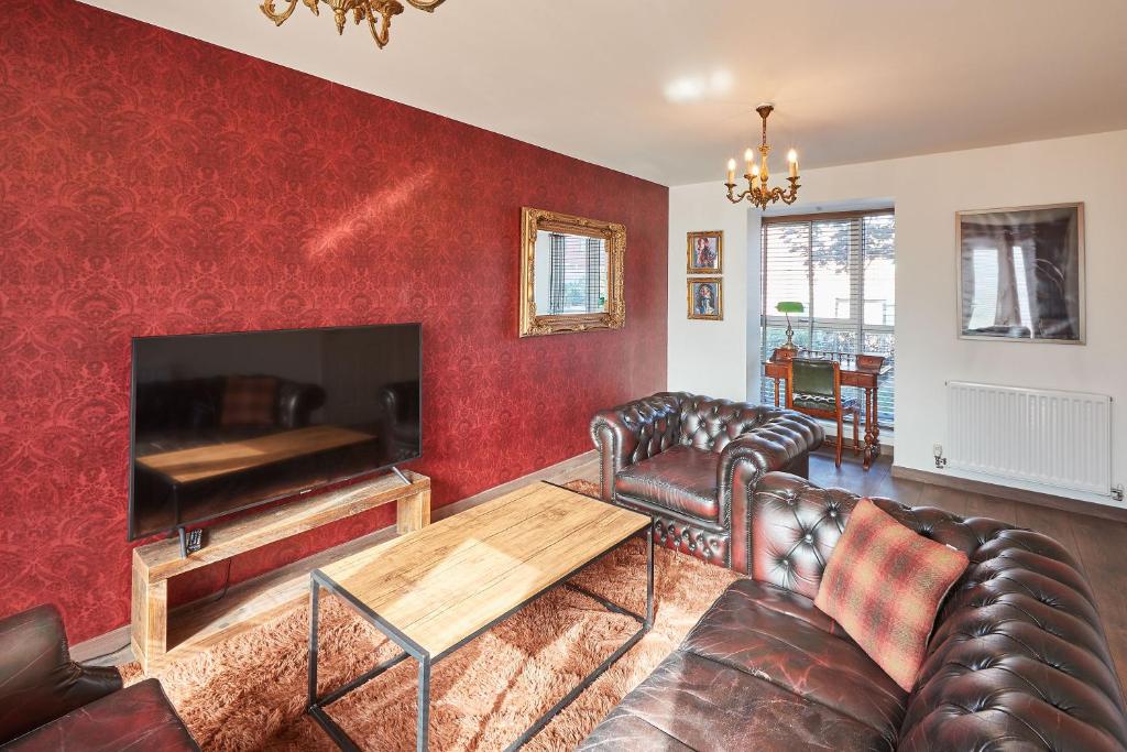 a living room with a couch and a table at Host & Stay - Greenfinch Road in Coventry