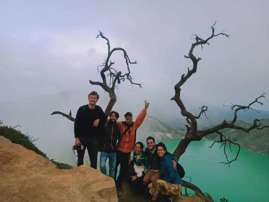 a group of people standing on top of a mountain at jala sutra cottages in Giri