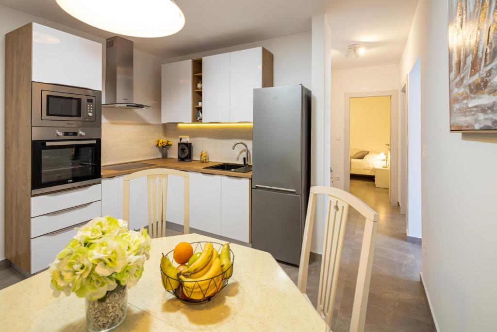 Kuchyňa alebo kuchynka v ubytovaní Apartment Navika