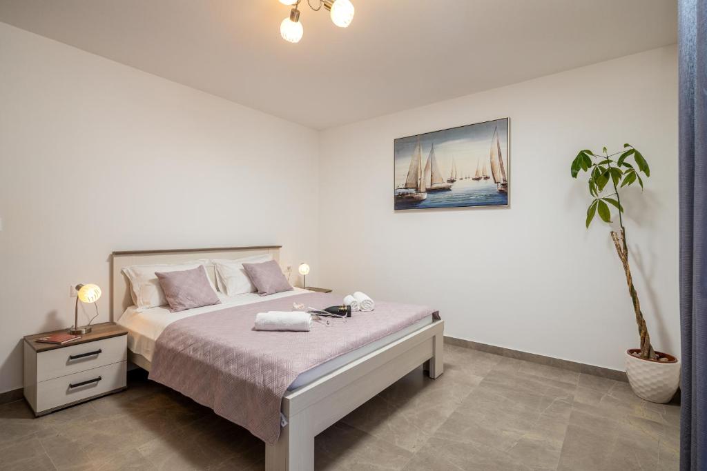 Posteľ alebo postele v izbe v ubytovaní Apartment Navika