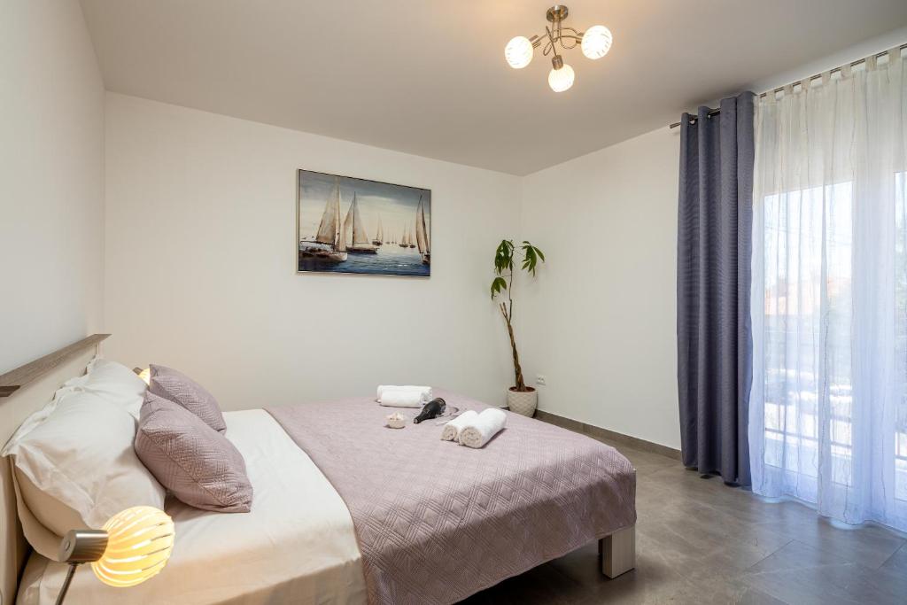 Posteľ alebo postele v izbe v ubytovaní Apartment Navika