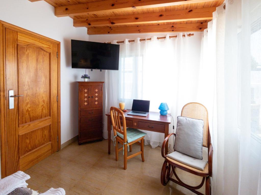 Televízia a/alebo spoločenská miestnosť v ubytovaní Villa La Maja Beachfront