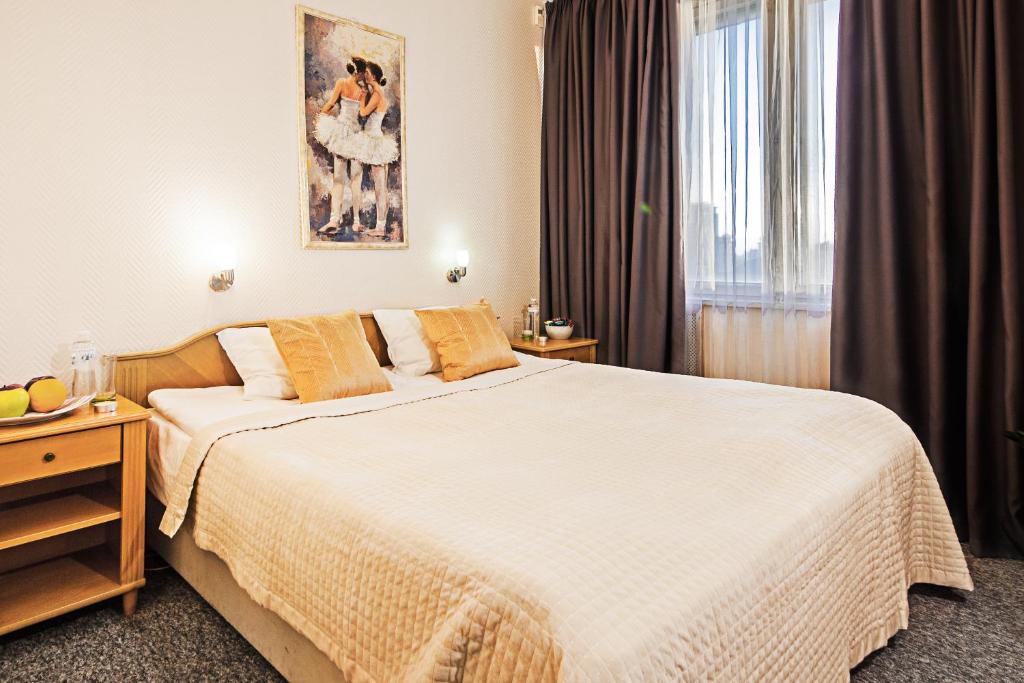 Postel nebo postele na pokoji v ubytování Mini-Hotel Kyivskyі