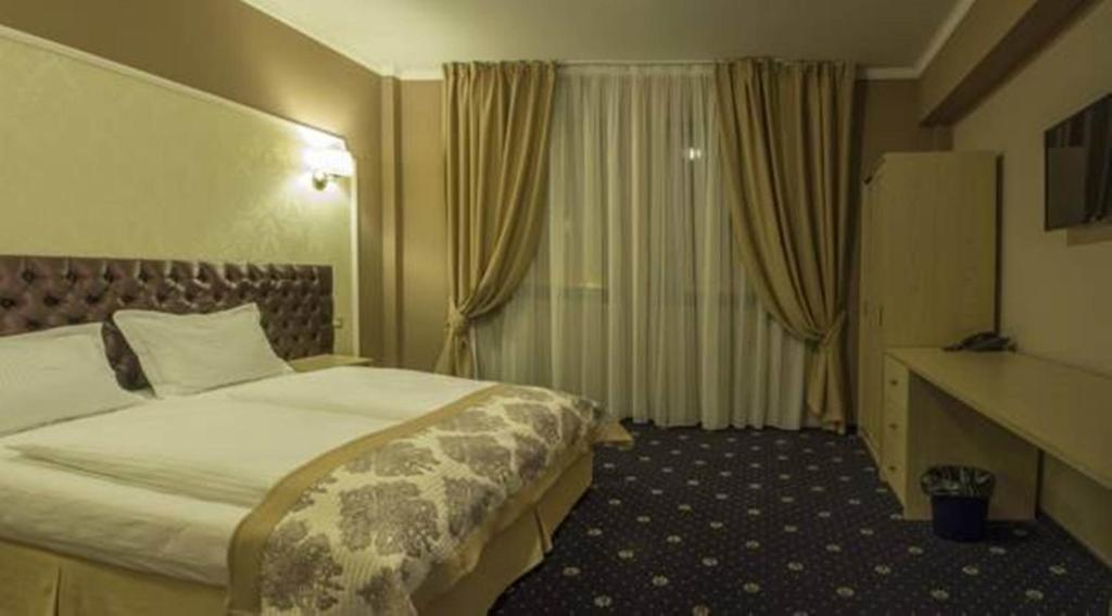 Postel nebo postele na pokoji v ubytování Hotel Bulevard