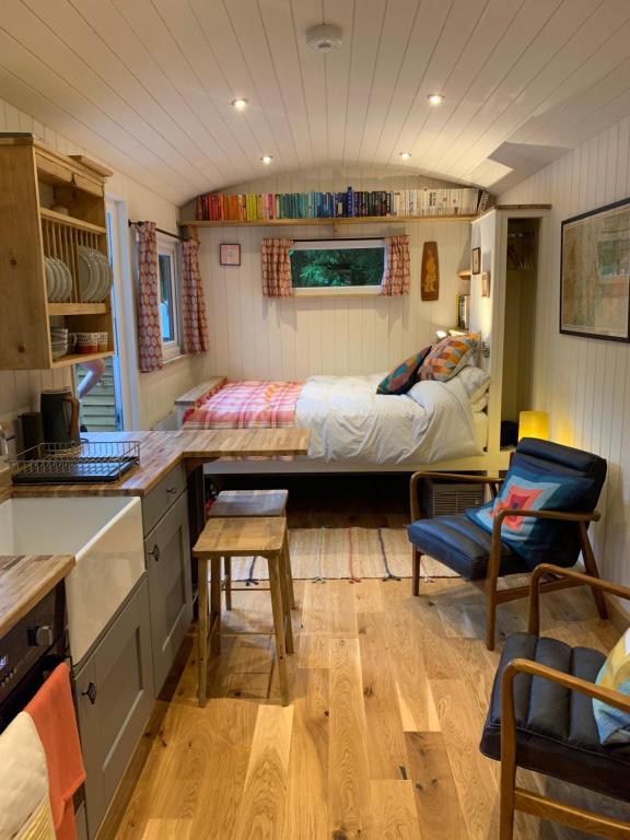 a kitchen and living room of a tiny house at Shepherd’s delight in Tintern