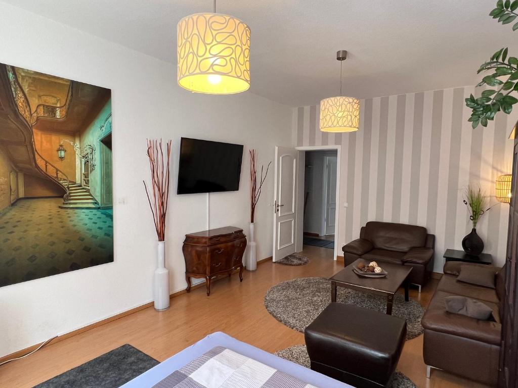 TV a/nebo společenská místnost v ubytování Pension-Leipzig-Süd