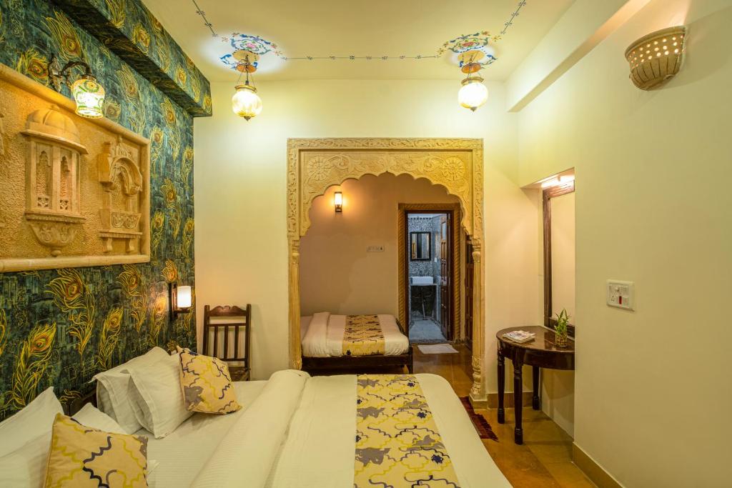 Postel nebo postele na pokoji v ubytování Tripli Hotels Prithvi Palace