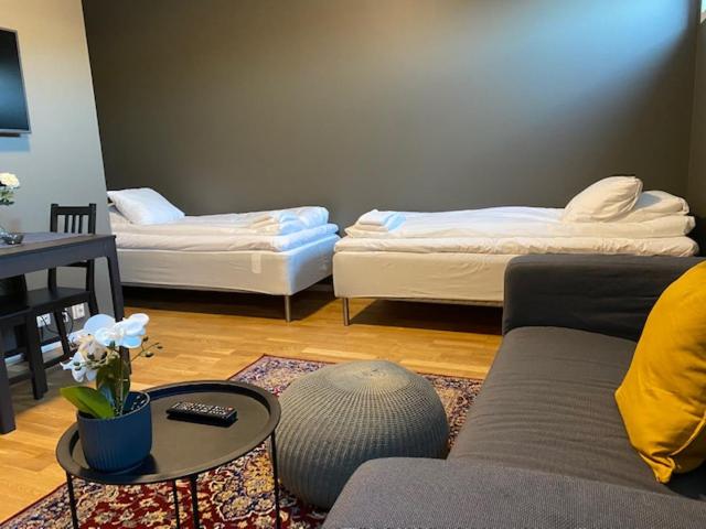Postel nebo postele na pokoji v ubytování Magnolia House Norrviken