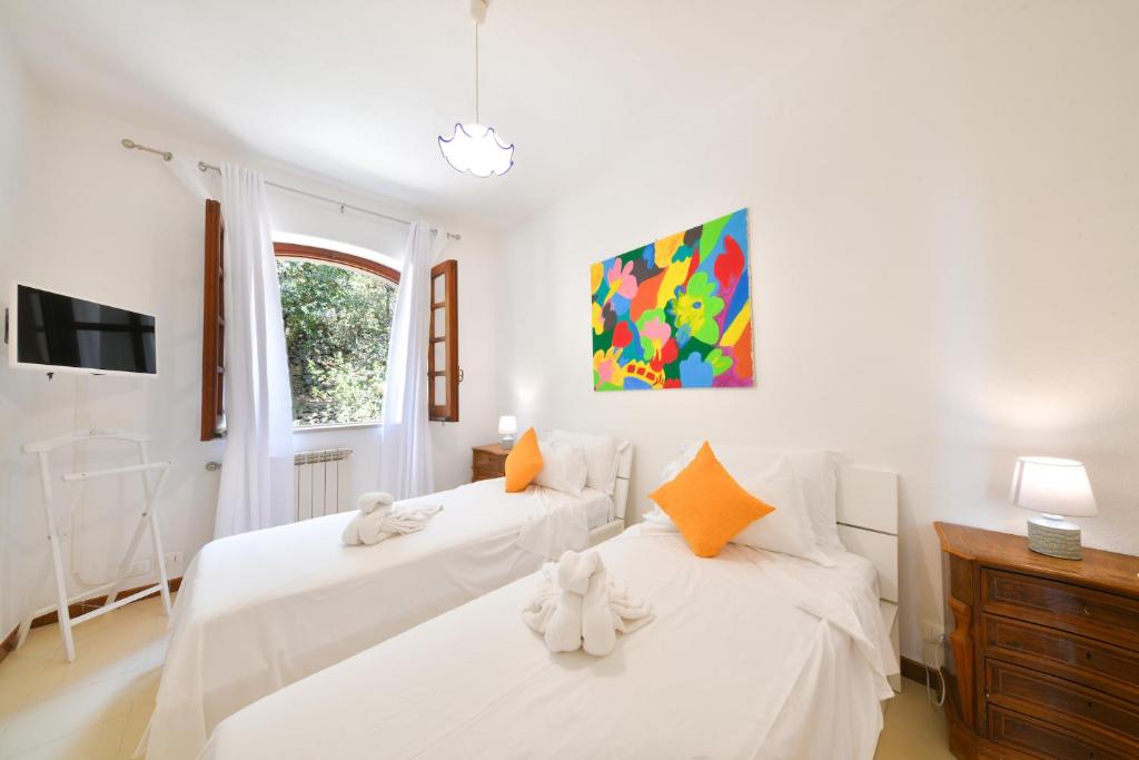 Postel nebo postele na pokoji v ubytování Villa Marecoco