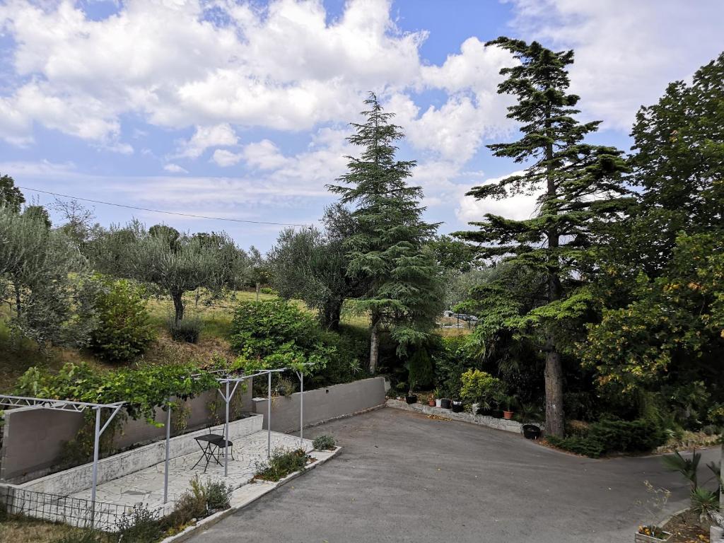 a parking lot with trees and a fence at ROSEMARIN in Koper