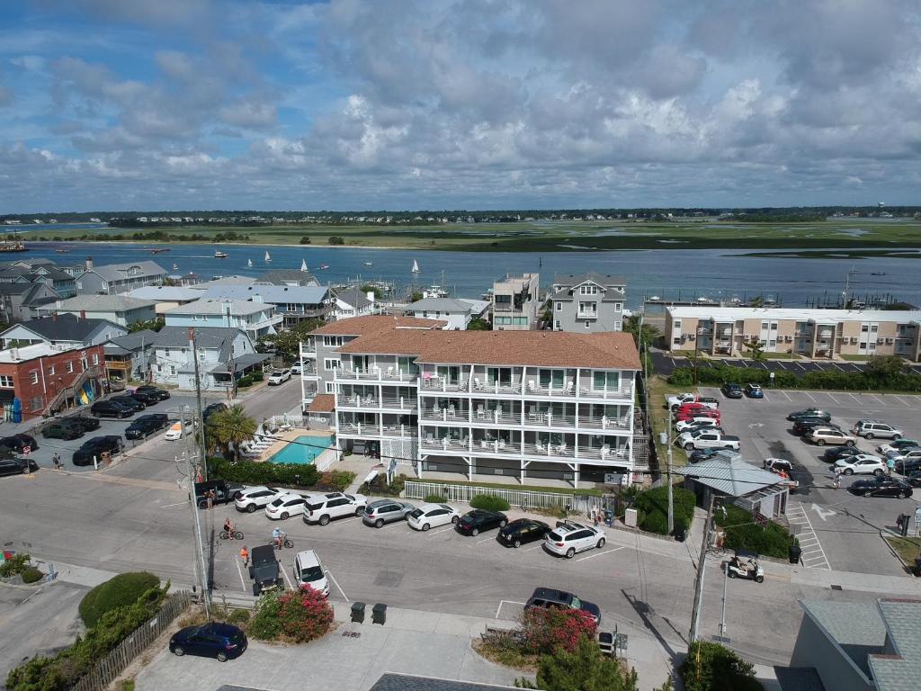 an aerial view of a town with cars parked in a parking lot at Sandpeddler Inn and Suites in Wrightsville Beach