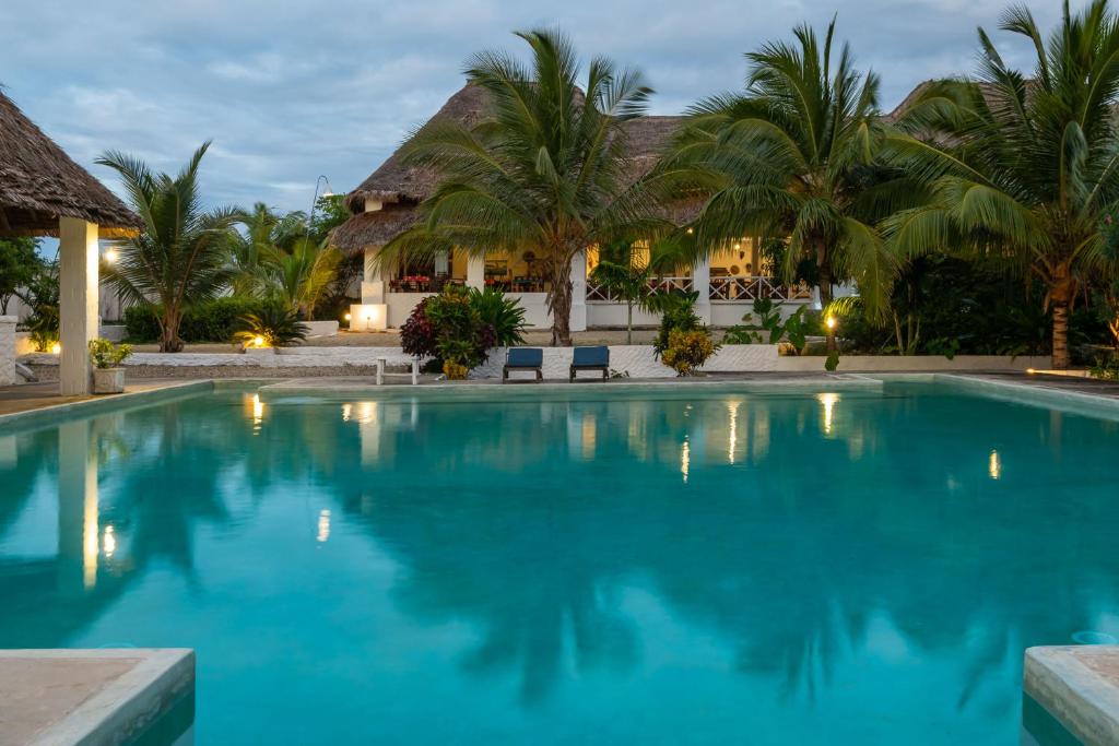 a swimming pool in front of a resort at Pemba Paradise in Makangale